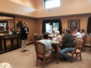 President Bobby Dunn speaks to families and residents about Guardian Pharmacy of NWFL during a family night program at Superior Residences of Niceville, Florida.